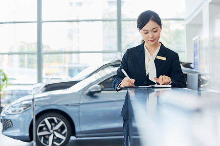 女性汽车销售导购员工作形象背景图片