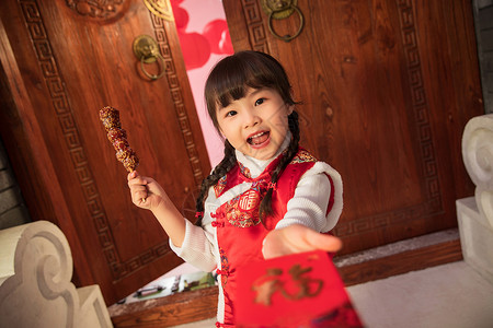 小孩吃糖葫芦吃糖葫芦的快乐小女孩背景