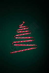 丝带摆成圣诞树形状背景图片