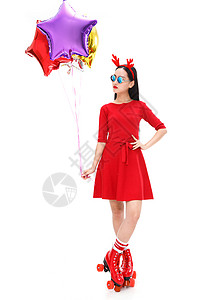 红色星形光效拿着气球的年轻女人背景