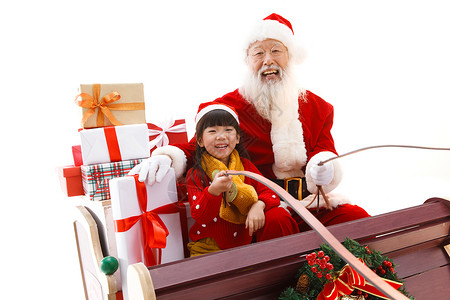 圣诞老人和女孩坐在雪橇上图片