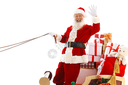圣诞老人坐在雪橇上招手图片