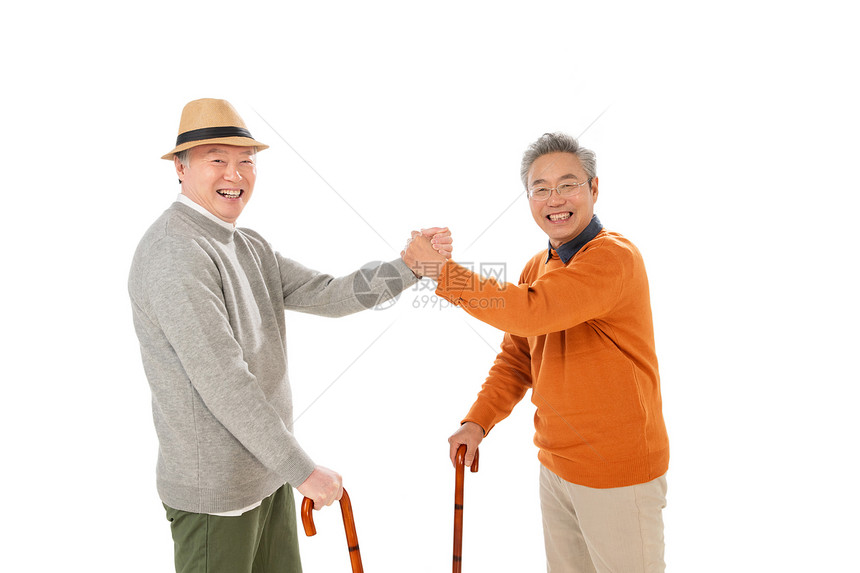 拿着拐杖的老哥俩握手聊天图片
