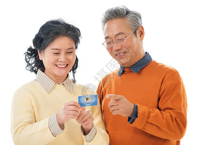 医疗金融幸福的老年人拿着卡片背景