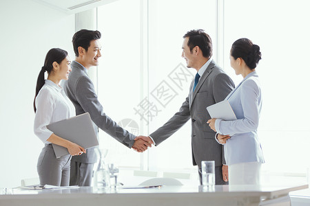 男秘书商务人士手握手合作背景