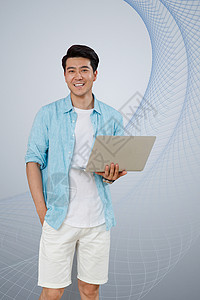 灰色纹理科技使用笔记本电脑的青年男士背景