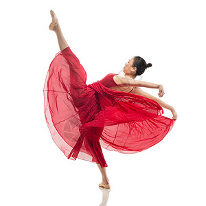 穿红色裙子跳芭蕾舞的青年女人高清图片