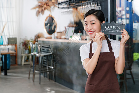 棕色牌子咖啡店的女服务员背景