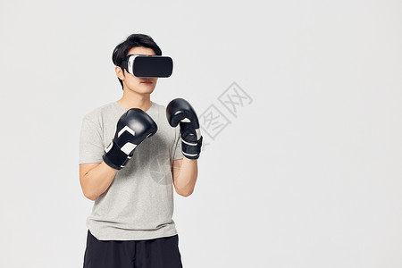 健身科技戴着拳套的男性使用vr眼镜背景