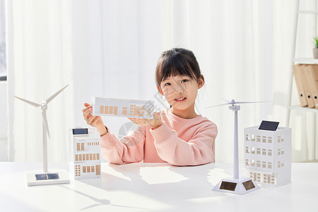 绿色节能建筑手拿建筑模型的小女孩背景