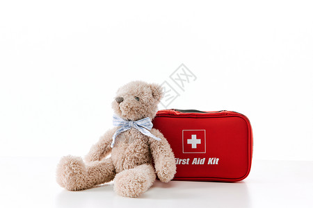 医用便携包和玩具小熊背景图片