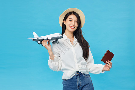 签证机票出国旅行坐飞机的青年女性背景
