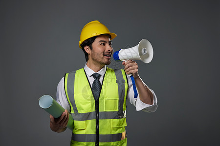劳动节宣传展板手拿喇叭的建筑工人背景