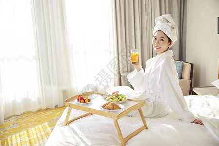 酒店休闲女性享受下午茶背景图片