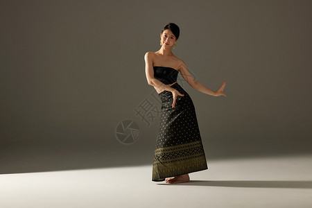 舞蹈民族少数民族傣族女性舞蹈动作背景