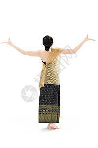 穿着傣族服饰舞蹈的女性背影图片