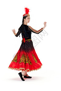 穿着维族服饰跳舞旋转的女孩背景图片