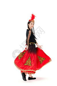 穿着维族服饰跳舞的女孩背景图片