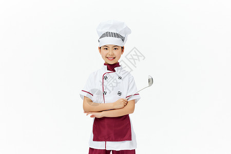身穿厨师服的小女孩拿着勺子图片