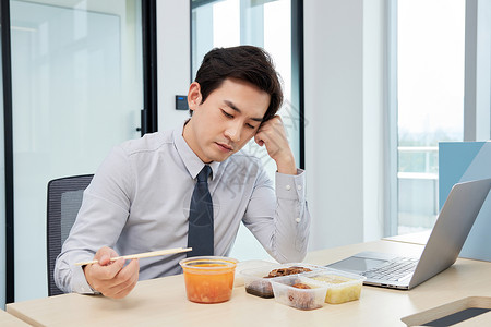 商务白领男性吃饭没胃口背景