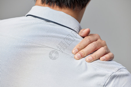 颈椎病治疗商务男士肩颈疼痛特写背景
