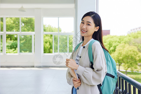 背书包的男生女大学生背书包形象背景