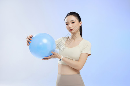 电子球运动少女手拿瑜伽球形象背景