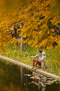 男孩钓鱼动作湖边钓鱼的父子俩背景