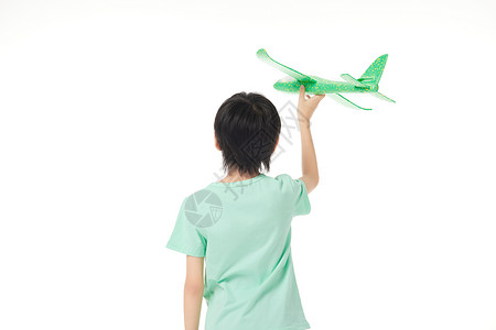 儿童手举飞机背影图片