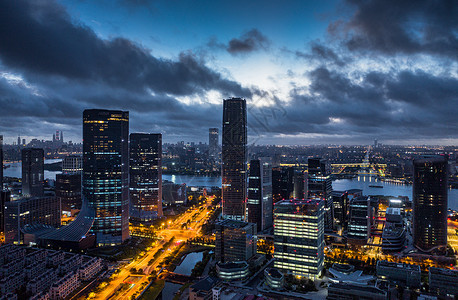 航拍上海徐汇滨江西岸城市建筑云海日出背景图片