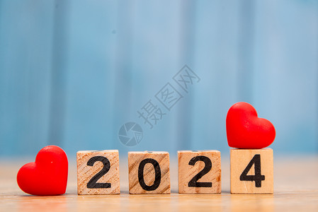 2024龙年花蓝色木板桌上的数字积木2024背景