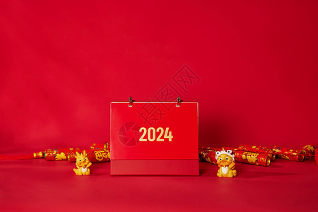 龙年节日红色创意新年金色摆件和2024万年历背景