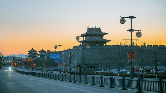 山西忻州古楼建筑街道日出景观背景