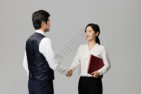握手的商务男女背景图片