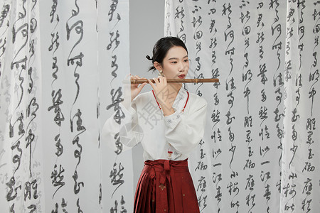 中国风笛子吹着笛子的古风美女背景