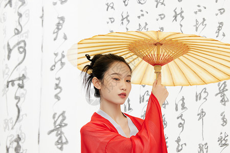 中国风美女手撑油纸伞背景图片