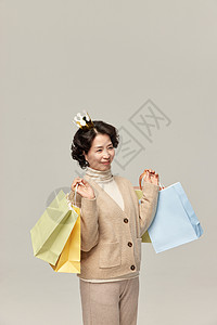 中年女性购物形象背景图片
