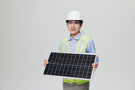 板板设计素材专业工程师拿着太阳能板研究采光问题背景