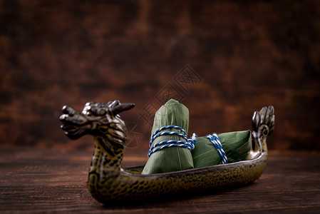 赛龙舟、端午节绿色粽叶粽子背景