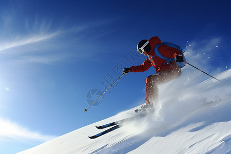 滑雪者在深蓝色的天空下进行跨度滑雪高清图片