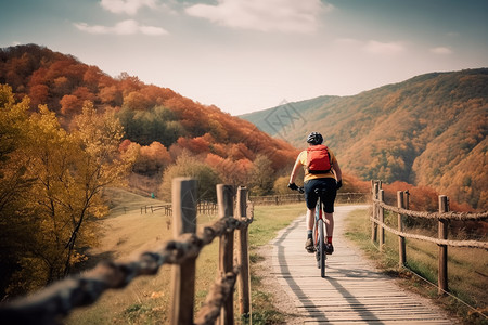 秋季山区骑自行车的人背景图片