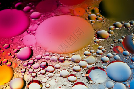 抽象彩虹油滴水艺术背景图片
