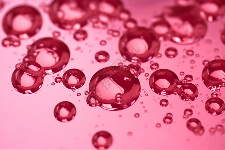 抽象粉色聚焦油滴背景图片