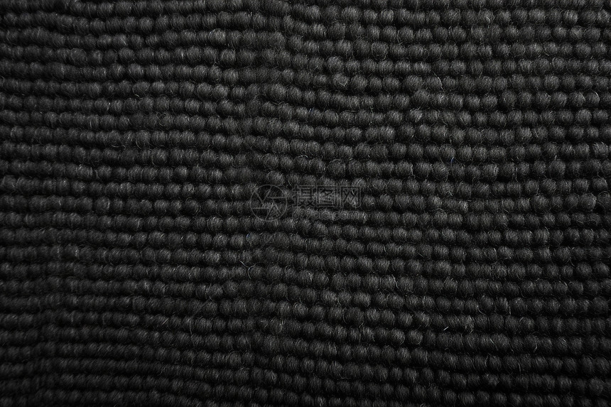 黑色编织紧密织纹地毯特写图图片