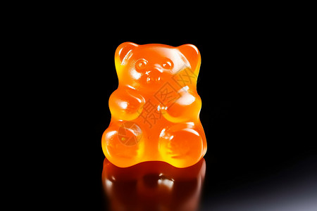橙色软糖黑色背景下的小熊软糖背景