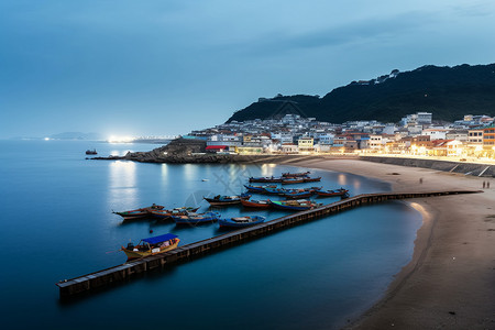 海岸小镇夜晚夜晚的港口背景