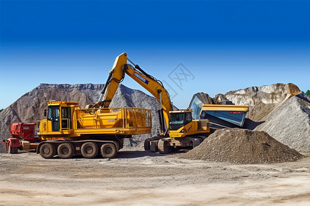沙土素材挖掘机在挖土设计图片