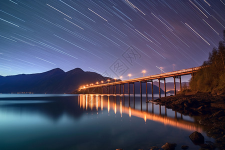 夜晚的海星空下的栈桥设计图片