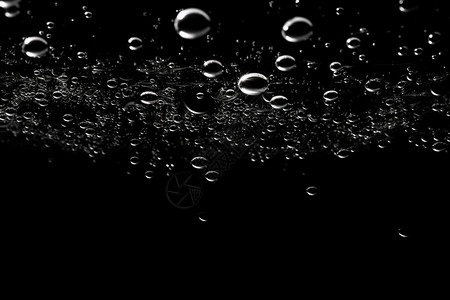 碳酸泉黑色背景上的气泡设计图片