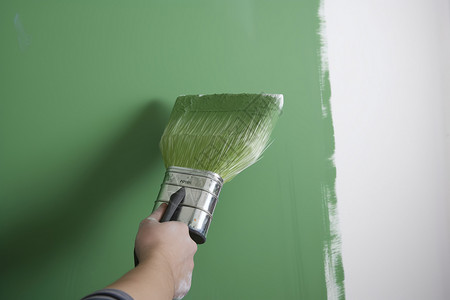 家居油漆工人粉刷墙壁背景